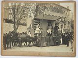 an old photo of a horse drawn carriage with a man on it