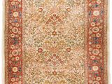 an antique persian rug with a floral design on a red ground