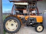 a tractor that is parked in a garage