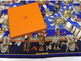 an orange box sitting on top of a blue and orange table cloth