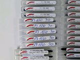 a lot of pens that are in a plastic case