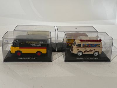 two toy vehicles in a display case on a white surface