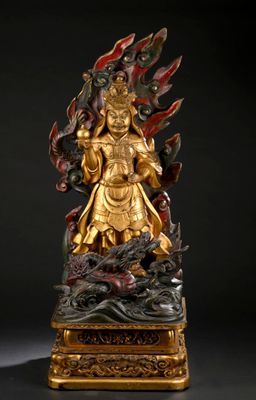 statue of a golden buddha on a black background with a black background