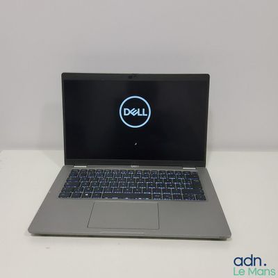 the dell laptop is sitting on a white table