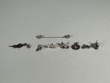 five pairs of earrings that are sitting on a table