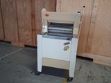a machine that is sitting on the floor next to a wall