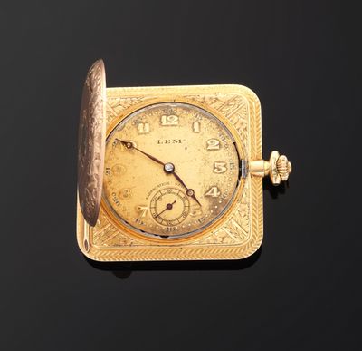an image of a gold pocket watch on a black background