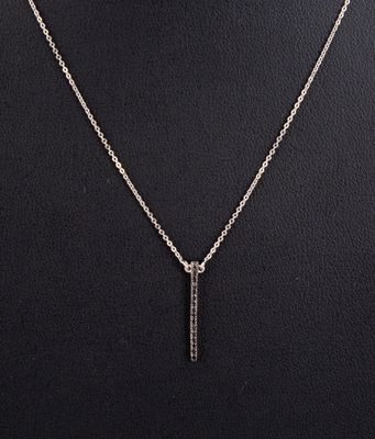 a silver necklace with a bar pendant on a mannequin mannequin mannequin mannequin mannequin mannequin mannequin manne