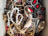 a white box filled with lots of different types of jewelry