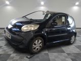a picture of a small black car on a checkered floor