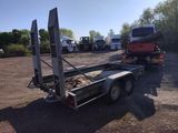 a flat bed trailer with a flat bed trailer attached to it