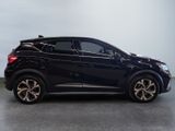 the black car is parked on the concrete floor in the room