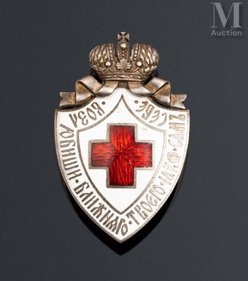 an image of a badge with a red cross on it