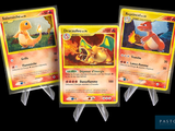 Trois cartes Pokémon sont présentées sur un fond noir