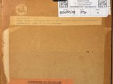 a cardboard box with a pair of scissors on it