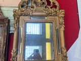 a mirror sitting on a table next to a mirror