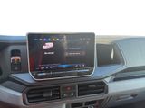 the dashboard of a car with a tablet on the dashboard
