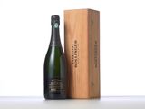 a bottle of champagne in a wooden box next to a wooden box