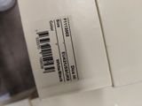 a box with a barcode on it sitting on a counter