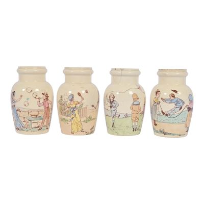 three vases with pictures of people on them sitting next to each other