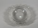 a clear glass bowl on a table with a white background