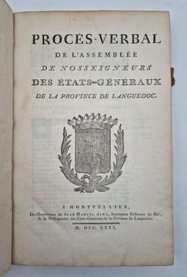 an open book with a picture of a coat of arms on it