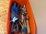 a box full of tools sitting on the floor