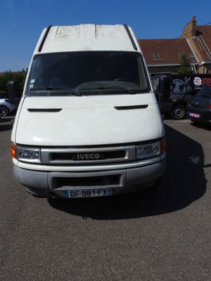 a white van that is parked in a parking lot
