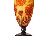 a glass vase with a floral design on it