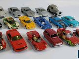 a lot of toy cars that are lined up together