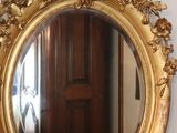 a mirror that is sitting on a wall next to a mirror