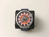 a close up of a watch on a white surface