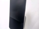 a cell phone that is sitting on top of a stand