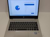 an open laptop computer sitting on top of a white table