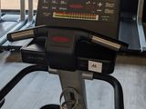 a tread machine in a gym with a monitor on it
