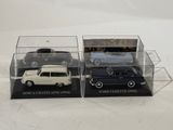 two model cars in a clear display case