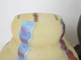 two vases sitting next to each other on a table