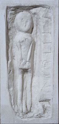 a white relief of a man holding a knife in his hand