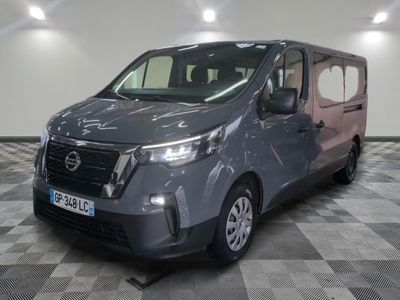 the grey van is parked on a checkered floor in a room