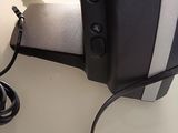 an image of a tv that is connected to a charger