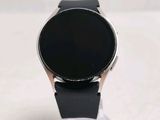 a smart watch that is sitting on top of a stand