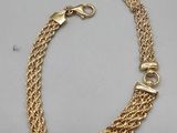 a gold chain bracelet with clasps and clasps