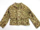 the jacket is made of camouflage fabric and has a long sleeve
