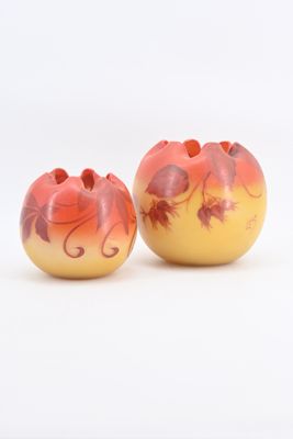 two apples sitting next to each other on a white surface