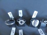 five different types of rings on display on a table