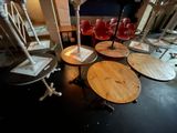 many chairs and tables in a room with a fan on the wall