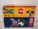 two boxes of pedigree cat food sitting on top of each other