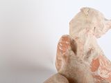 a statue of a bear that is sitting on the ground