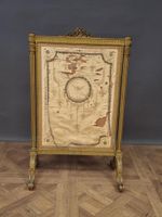 Ecran de cheminée en bois doré de style Louis XVI.