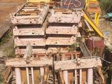 a pile of crates sitting on the ground next to a building